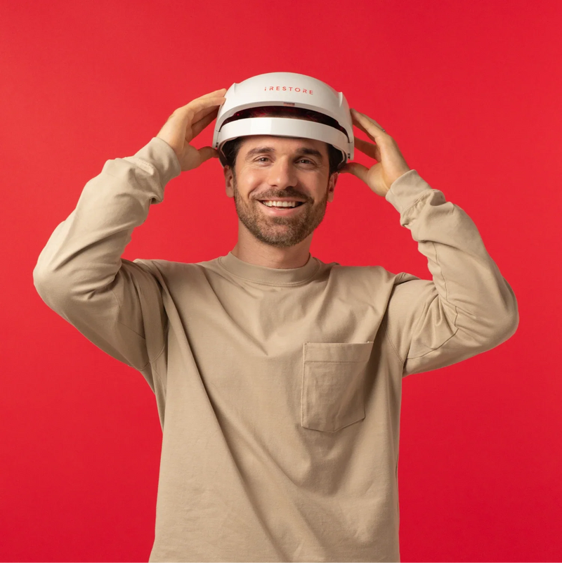Image of a middle aged man wearing the Essential hair device.