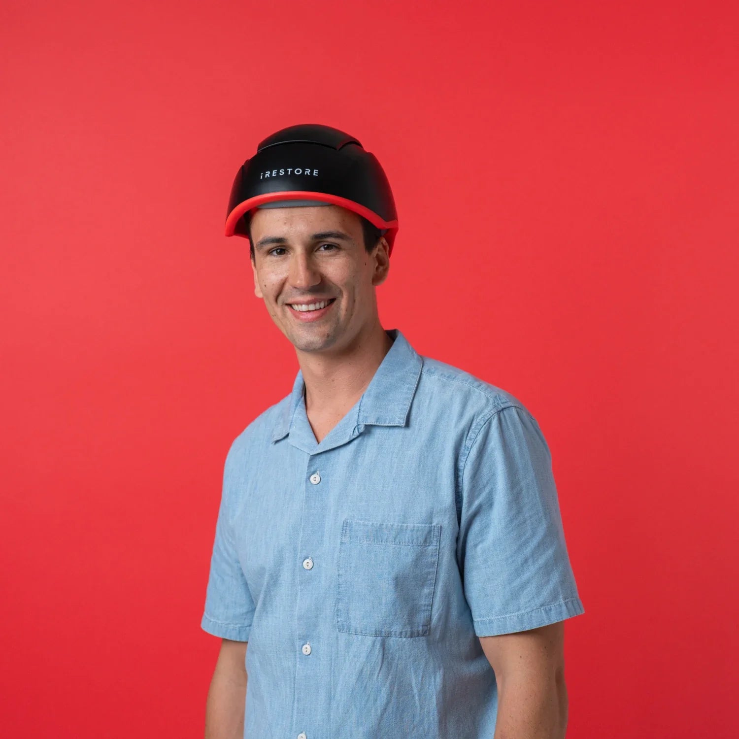 Image of a middle aged man wearing the Elite hair device.